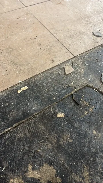 Black bitumen mastic floor removal in a SE16 flat